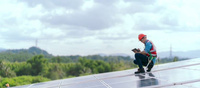 Worker on a solar panel