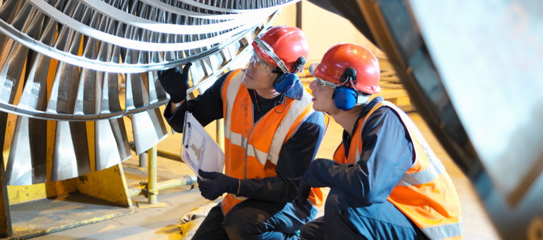 Two engineers inspecting an installation