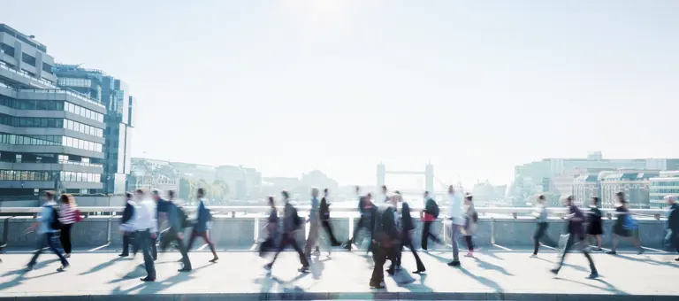 People crossing London Bridge