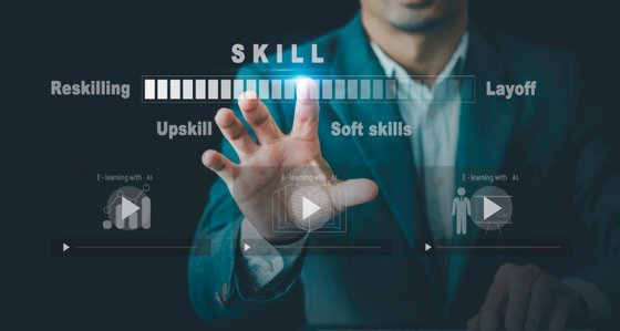 Man pointing at words including Skills, Layoff, Upskill, Reskilling