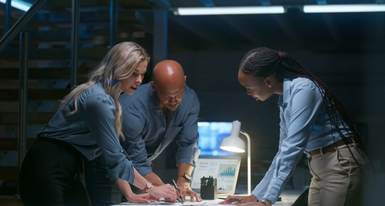 Three people working on a project