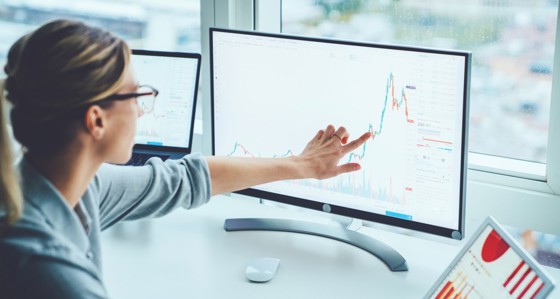 Woman pointing at a computer screen