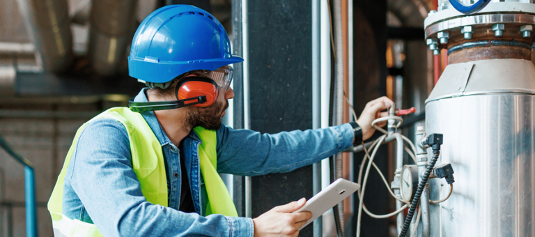 Engineer inspecting machinery