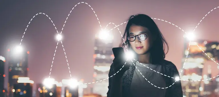A woman with her phone and graphical overlay