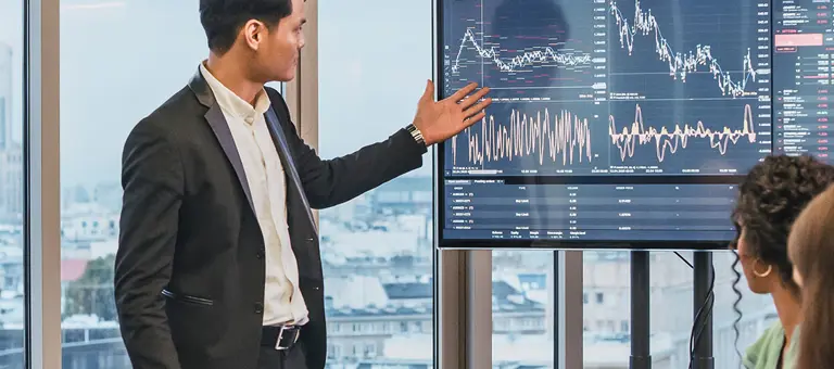 Group of people in a business meeting analysing data
