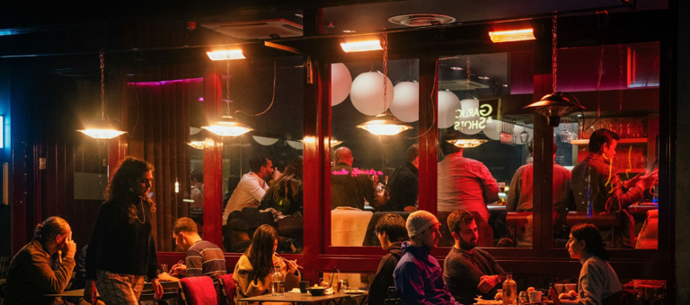 People sitting in a bar restaurant at night
