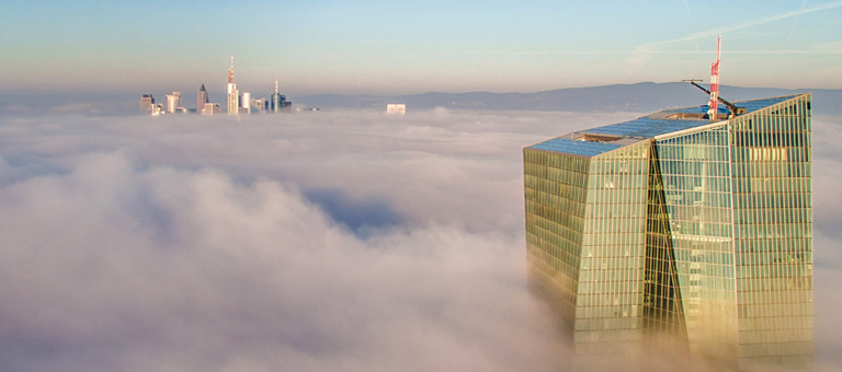 The tops of New York skyscrapers emerging from the clouds