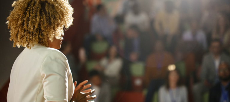 Woman speaking at an event