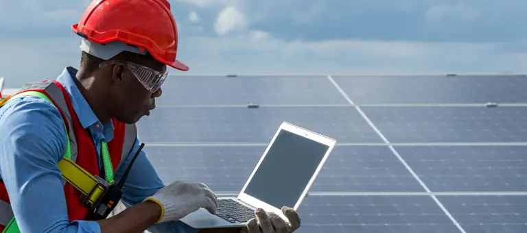 engineer installing solar panels
