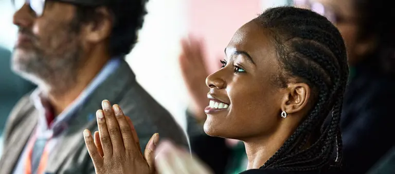 Group of people clapping their hands
