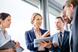 Five work colleagues in discussion