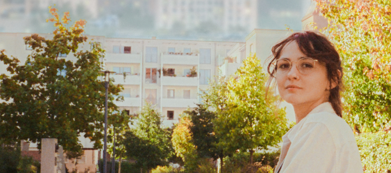 Woman in a leafy neighbourhood