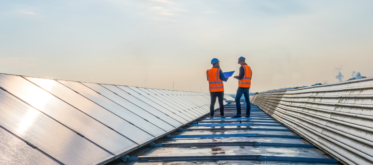 Workers on solar panels