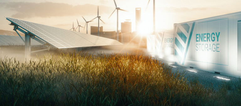 Solar Panels, wind turbines and energy storage units in a grassy field