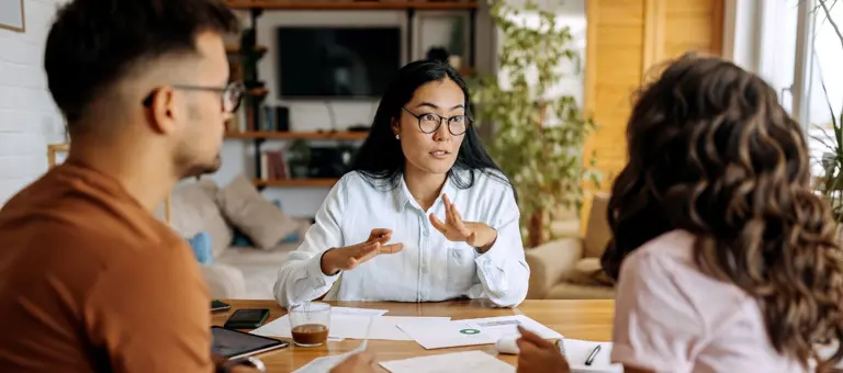 Young couple getting advice from financial expert