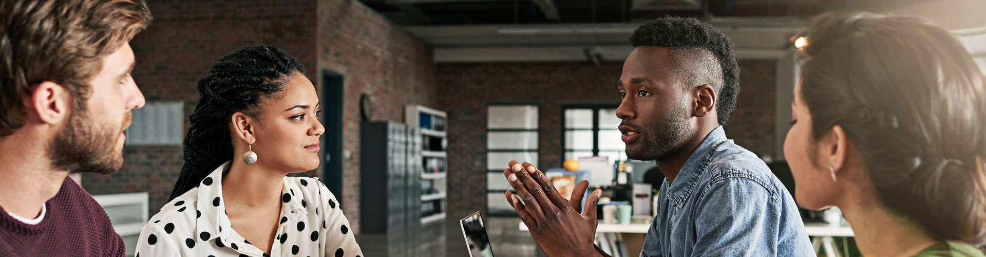 Shot of a team of colleagues having a meeting in a modern office