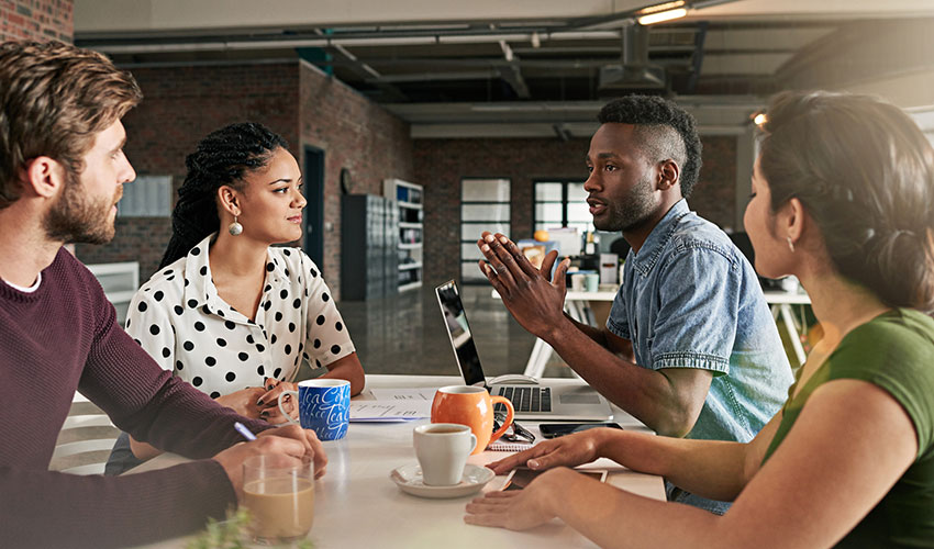 Shot of a team of colleagues having a meeting in a modern office
