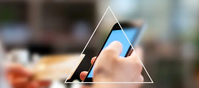 Looking a triangle to see a phone with rest of the image blurred