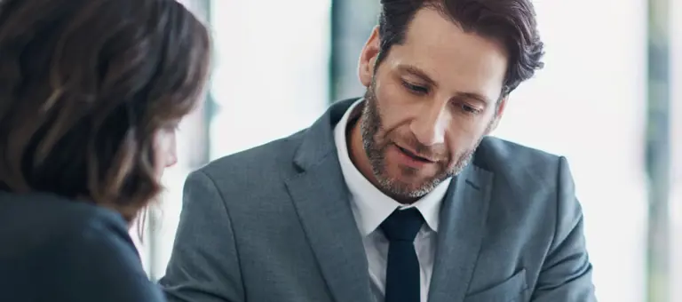 Two business people reviewing a document