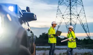 Workers near a pylon