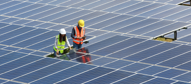 Workers working on solar panels
