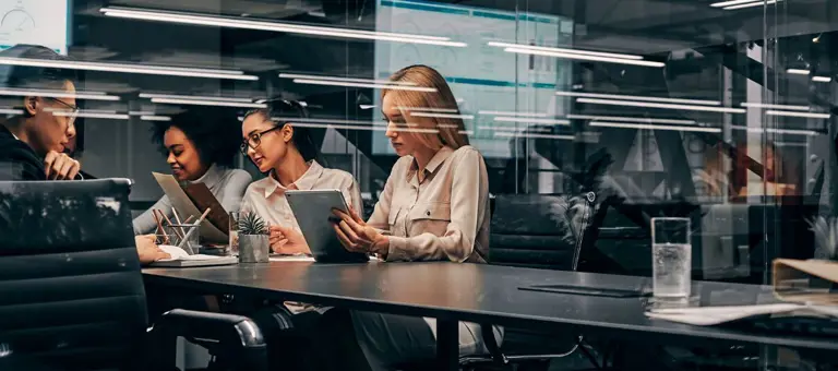 Team working in front of laptops
