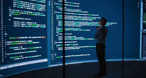 Business man computer screen coding