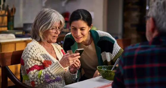 Two women looking at a mobile phone