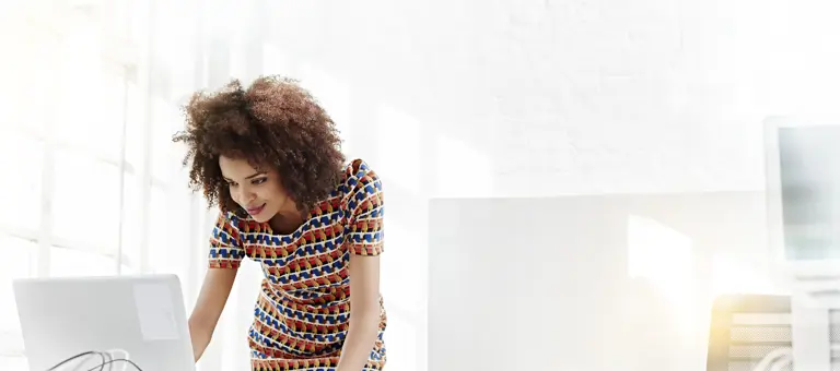 Businesswoman working on laptop.