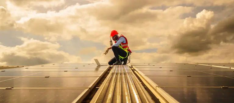 Worker on a solar panel