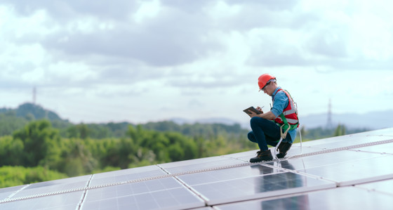 Worker on a solar panel