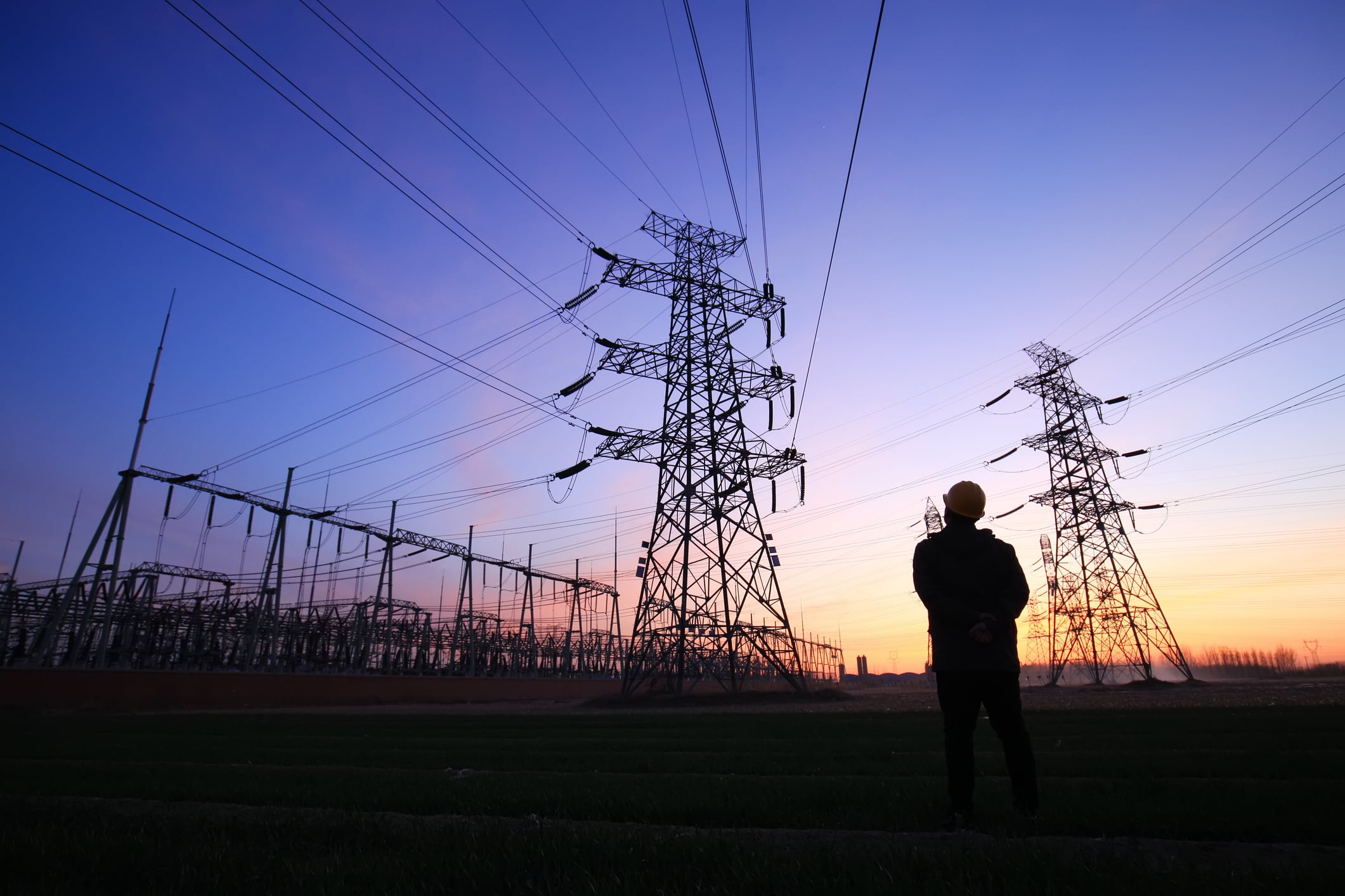 Worker looking at pylons