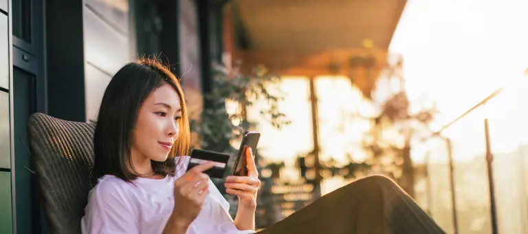 Woman online banking on mobile phone