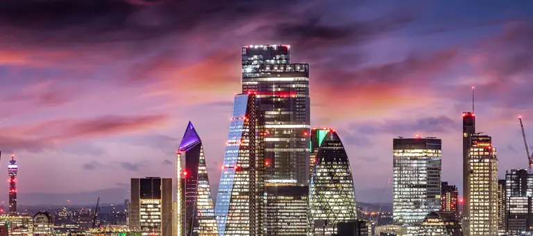 The London business district skyline lit up at dusk