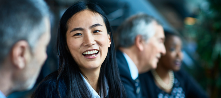 Woman smiling next to man