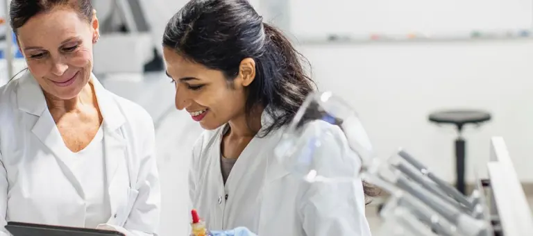 Two people in lab coats