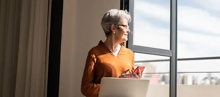 Woman looking out of a window