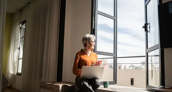Woman looking out of a window