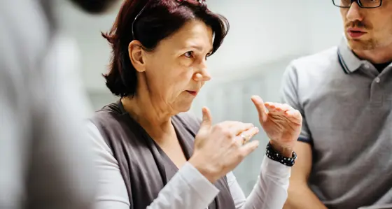 Woman in a meeting giving an explanation