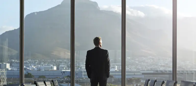 business man in office looking at view