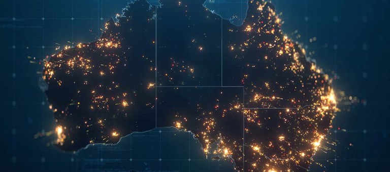 Australia shown from space at night with lights revealing the populated areas