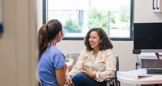 Female patient talking to a female doctor