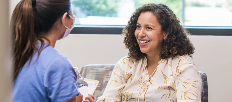 Female patient talking to a female doctor