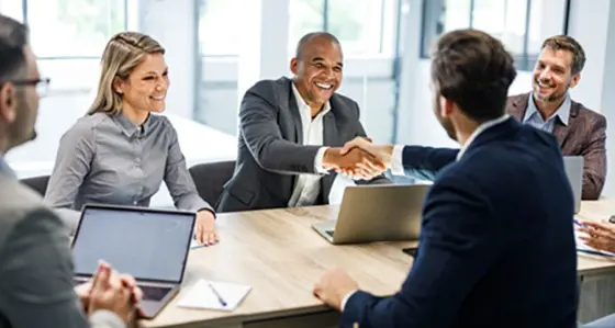 People in a meeting shaking hands