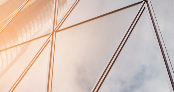 Skyscrapers reflected in triangular glass windows