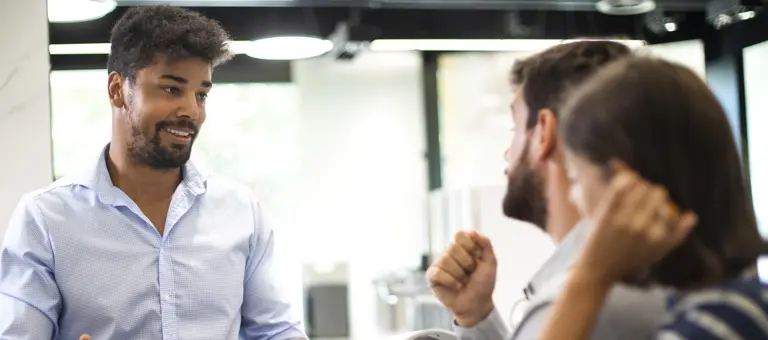 Three people having a conversation