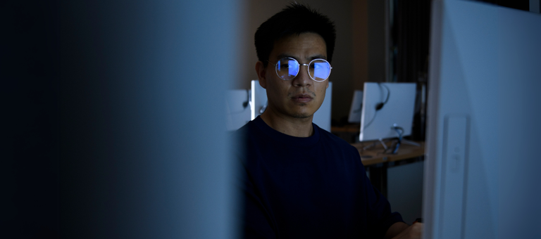 Computer hacker stealing information with computer