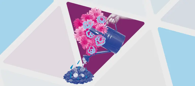 Hand holding a watering can