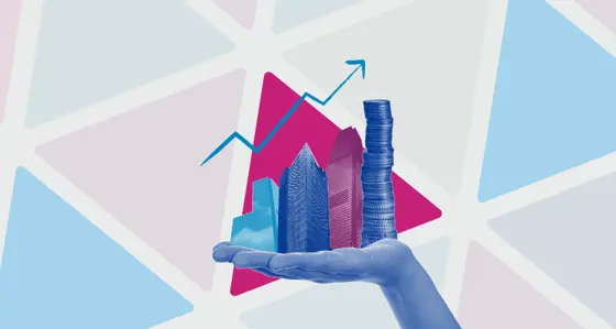 Hand holding skyscrapers and a pile of coins