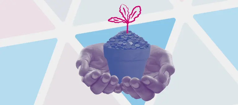 Hands holding a flower pot containing coins
